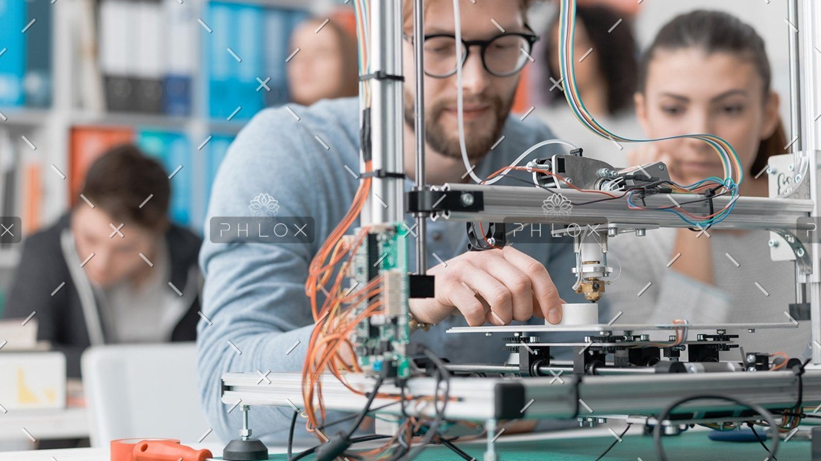 demo-attachment-61-students-using-a-3d-printer-PJKMSXD